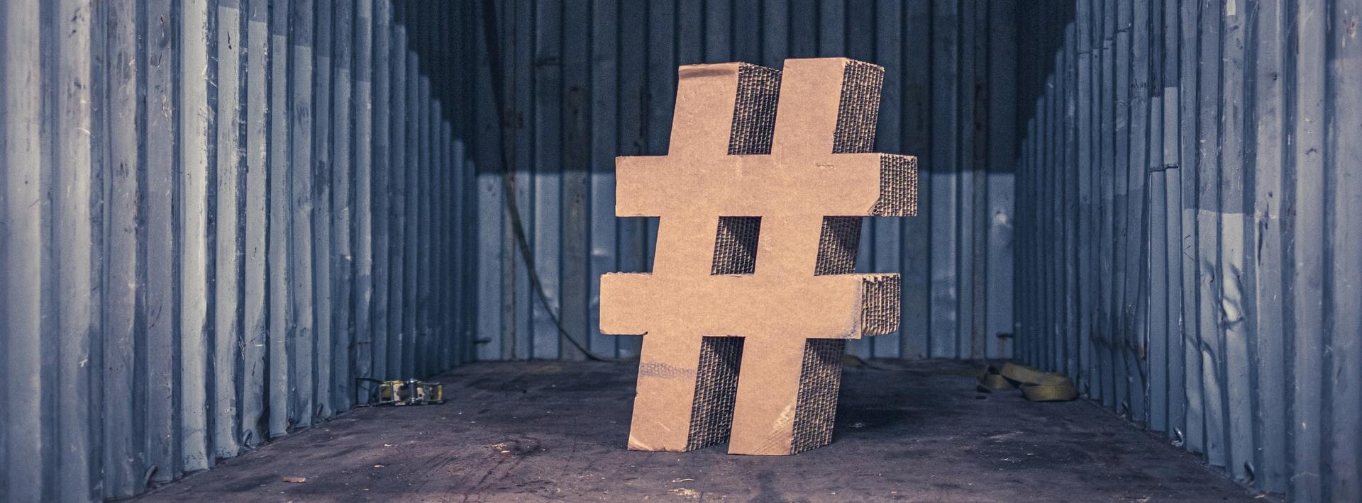 brown ampersand concrete statue inside an intermodal container